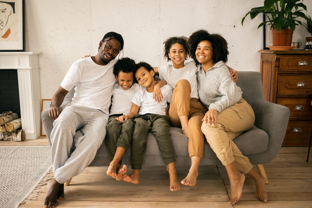 A family at home together in their living room